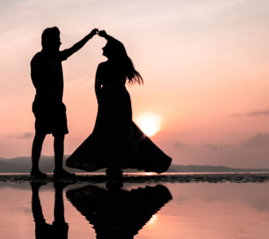 A couple dancing on a beach